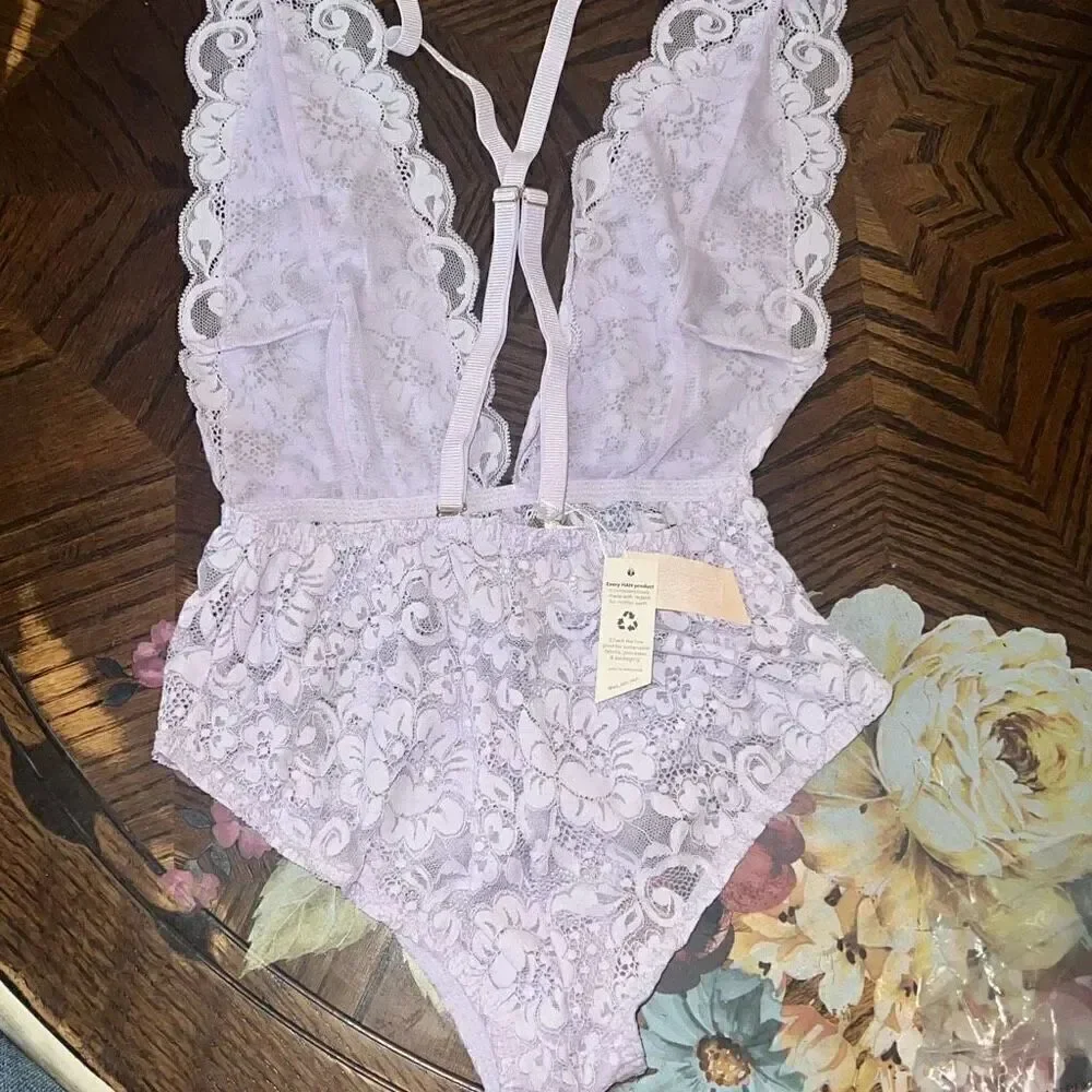 We are HAH Free People NWT comin in haht lace bodysuit purple XS